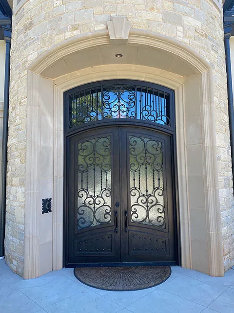 Single entry iron door with glass panels